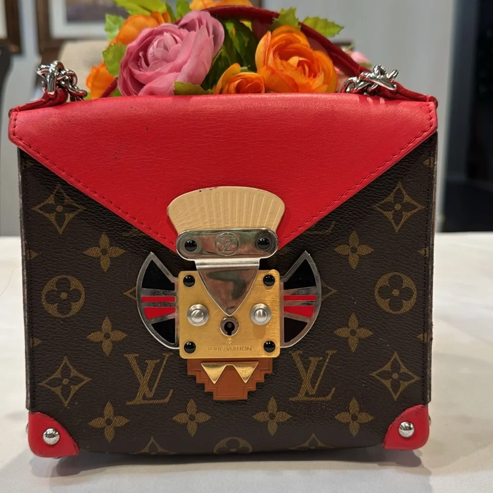Authentic Louis Vuitton Tribal mask chained shoulder bag